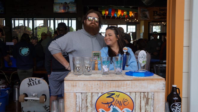 Ben Jones of 16 Mile Brewery and Tracy Huggans of 3rd Wave Brewery working together to promote their respective companies.