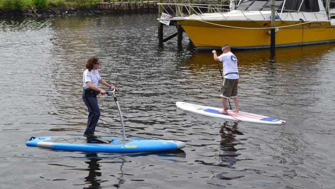 Salisbury Police Chief Barbara Duncan and Mayor Jake Day paddleboard on the Wicomico River on Thursday, April 27.