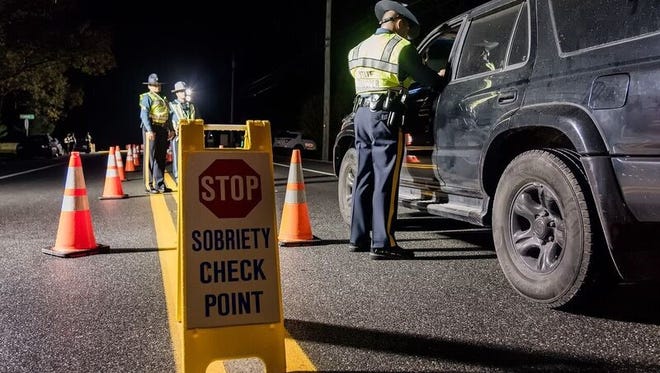 Delaware State Police stop vehicles at a DUI checkpoint in Seaford on Nov. 4.
