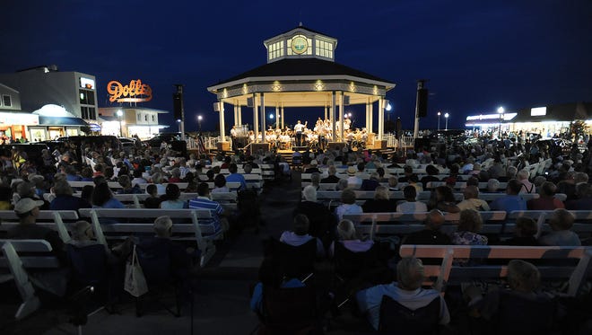 The U.S. Army Field Band and Soldier's Chorus performs at the Rehoboth Beach Bandstand to a large crowd of visitors.