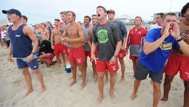 Rehoboth Beach Patrol members cheer on their teammates as Rehoboth Beach Patrol hosts the 40th annual Lifeguard Olympics on the oceanfront at Baltimore Avenue on Thursday, July 27 with beach patrols from Rehoboth, Dewey, Delaware State Parks, North Bethany, Bethany, South Bethany, Middlesex, Fenwick Island, and Ocean City, Maryland.