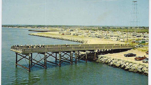 This vintage photo provided by Delaware Seashore State Park shows the old fishing pier on the north side of the Indian River Inlet, sometime in the 1960s.