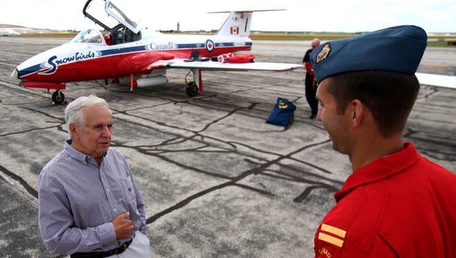 (L to R) The original pilot that in 1971-72 flew the number 2 Canadian Forces Snowbirds jet, Tom Gernack, of Clarkson talks with current pilot of the number 2 jet, Ave Pyne of Vancouver Island, British Columbia.