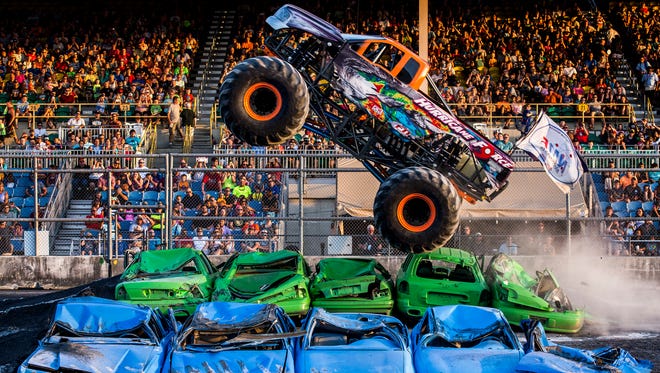 The Hurricane Force flies through the air during the Monster Truck Meltdown show at the Delaware State Fair in Harrington on Thursday evening.