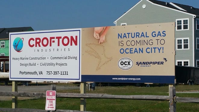Signs advertising natural gas is coming to Ocean City.