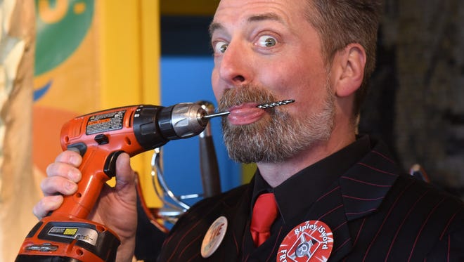 Tyler Fyre licks off the drill he had inserted into his nose at the Odditorium Grand Reopening of Ripley's Believe It or Not! on the Boardwalk in Ocean City Saturday, March 10, 2018.