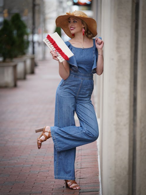 Skyler Bouchard wears a Do + Be denim jumper with flared legs and ties in the back with ALDO caramel leather strappy heels