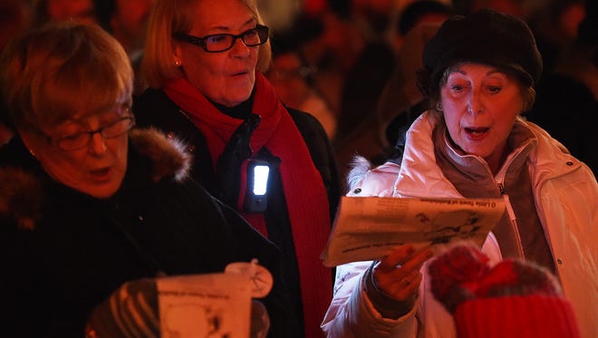 Participants sing  Christmas Carols on the Circle in Georgetown during the event Dec. 4.