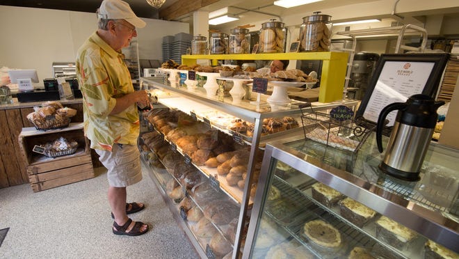 Mike South of Lewes purchases a cinnamon coffee cake at Old World Breads in Lewes.
