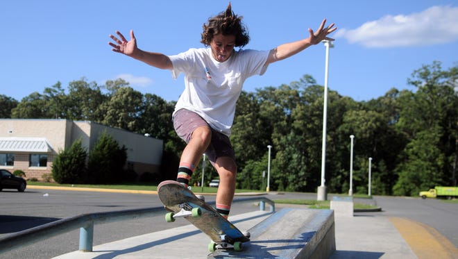 Jaimin Didomenicis, 13 of Rehoboth Beach, finishes his grind with a little bit a flair at Epworth Skate Park in Rehoboth Beach.