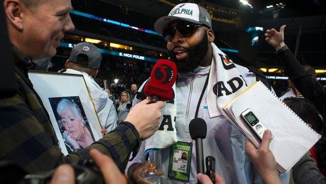 Eagles' Jason Peters takes questions from the media during the Super Bowl Opening Night Monday at the Xcel Energy Center.