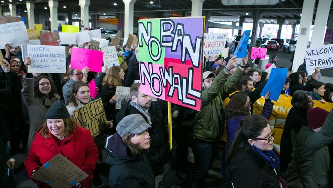 Thousands of protesters crowd Philadelphia International Airport Sunday to speak out against the president’s temporary ban on refugees from seven Muslim-majority countries.