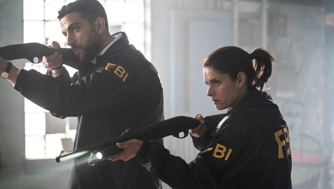 Zeeko Zaki, left, and Missy Peregrym play FBI special agents in CBS' 'FBI.'