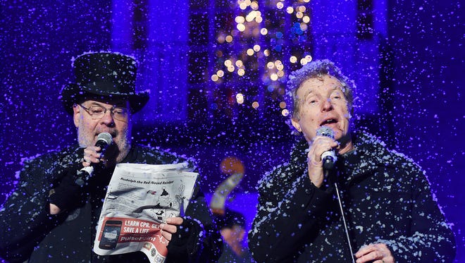 Make-believe snow falls during the closing performance of "Silent Night."
