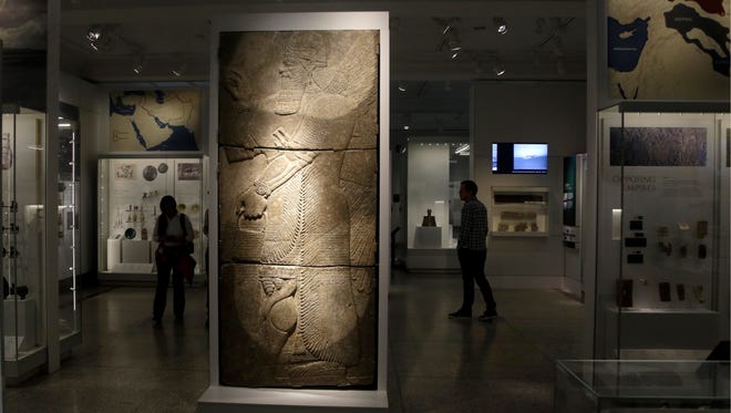 In this April 26, 2018 photo, part of the Middle East gallery is displayed at the Penn Museum in Philadelphia. The University of Pennsylvania Museum of Archaeology and Anthropology is opening the galleries to showcase previously undisplayed items, and is making the artifacts more relatable by adding guides native to those parts of the world.