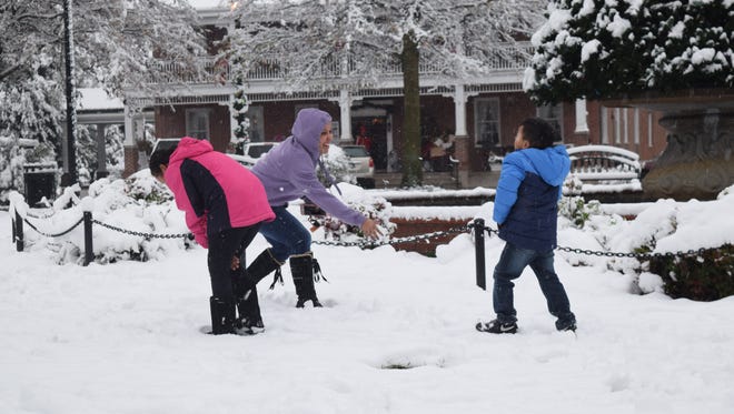 The Figueroa family enjoyed a snow fight in Georgetown on Saturday morning.