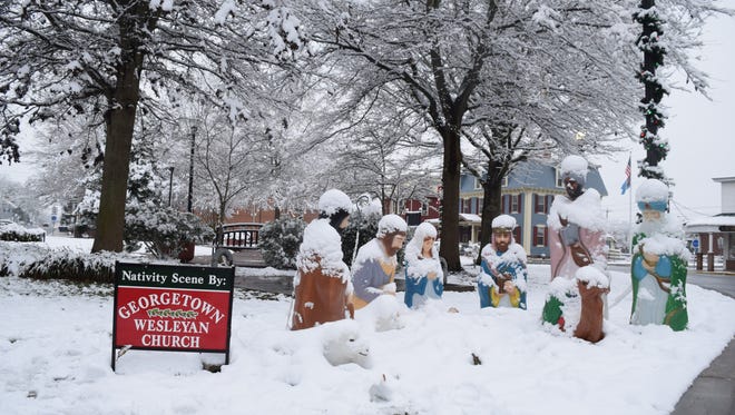 The nativity scene in Georgetown was blanketed in snow Saturday morning.