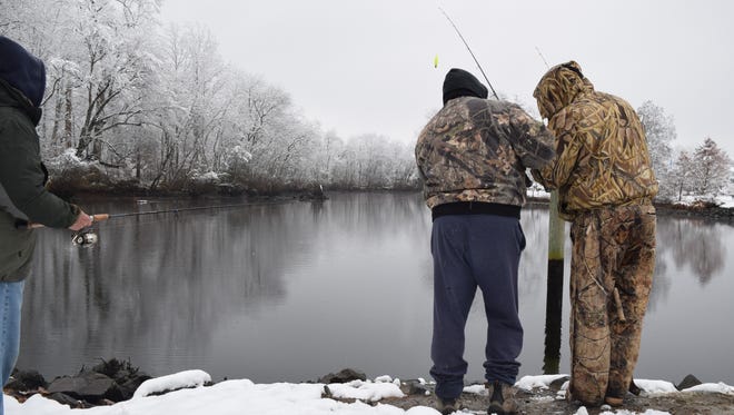Early fishing goes on, snow or shine.