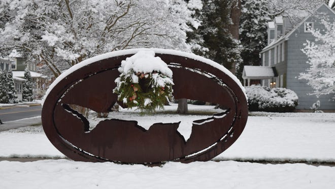The Dogfish Head sign in Milton got an extra festive touch with snow early Saturday morning.