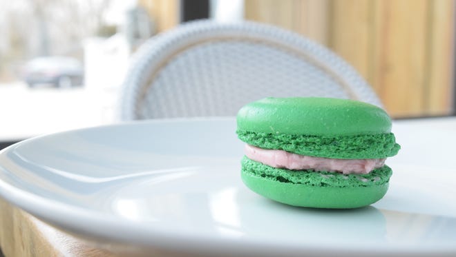 Patrons can sink their teeth into a hardy macaron. This one is flavored with bright raspberry.