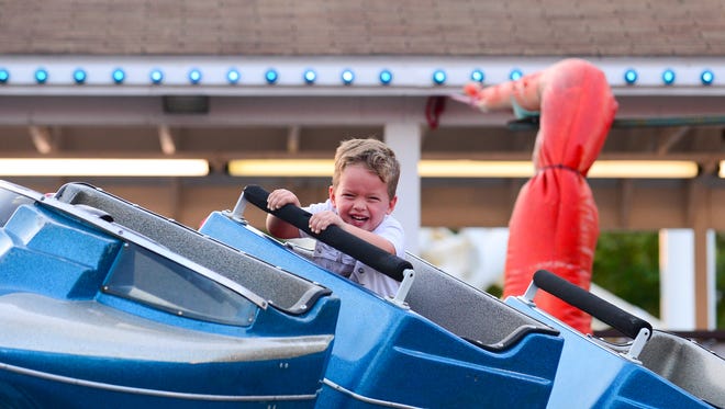 Harrison McDuffee, 3, Pennsylvania, enjoys the kiddie coaster at Trimper's Rides and Amusement park on Wednesday, Aug. 31, 2016.