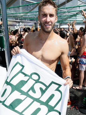 Shawn Booth joins Irish Spring to Break the Guinness World Records Title for the Most People Showering Simultaneously (single venue) at Firefly Music Festival at the Dover International Speedway on Friday in Dover.