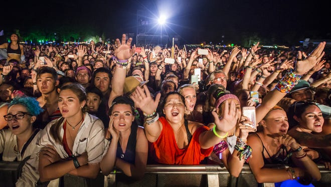 Female fans ride the rail in 2016 as Florence and The Machine performs the lone female-fronted headlining set in the seven-year history of Firefly Music Festival.