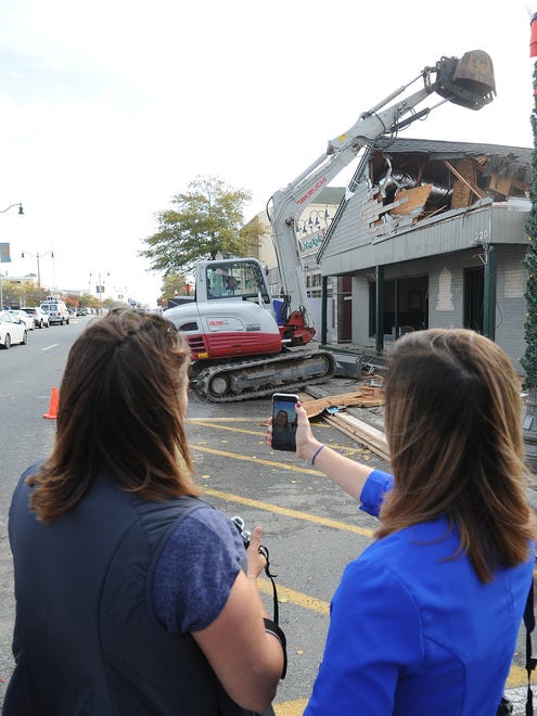 Mariah Caligione Owner and V.P. of Dogfish Head watch's as Demolition at the Dogfish Head's old brewpub on Rehoboth Ave. in downtown Rehoboth Beach began on Monday, Nov. 6, 2017 to make way for an outside courtyard between Chesapeake & Maine Restaurant and the new Dogfish Head Brewing and Eats.