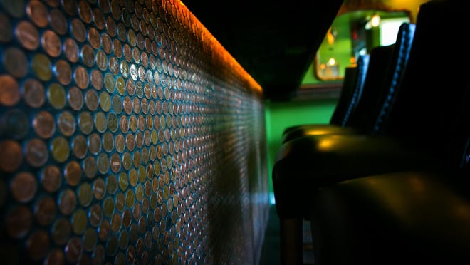 Thousands of pennies adorn the bar at Copperhead Saloon in Greenville.