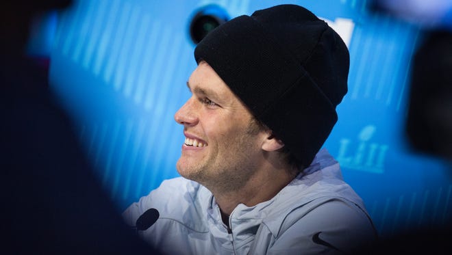 New England Patriots Quarterback Tom Brady smiles during his interview portion of the Super Bowl Opening Night Monday at the Xcel Energy Center.
