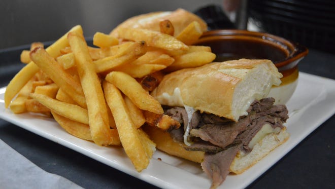 French dip with homemade Au Jus sauce and fries at Pit & Pub in Ocean City.