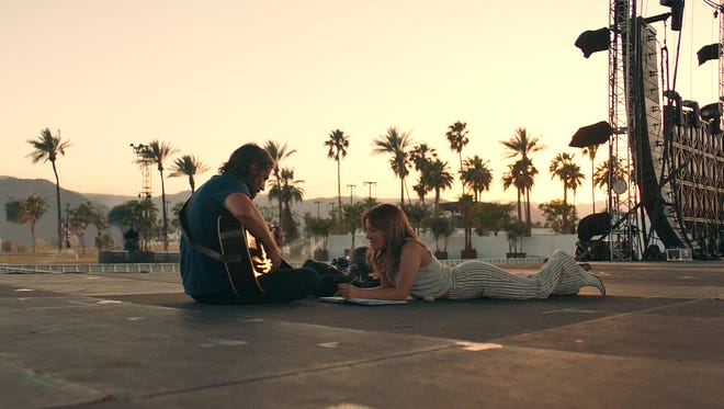 In "A Star Is Born," Jackson (Bradley Cooper) and Ally (Lady Gaga) work on a song.