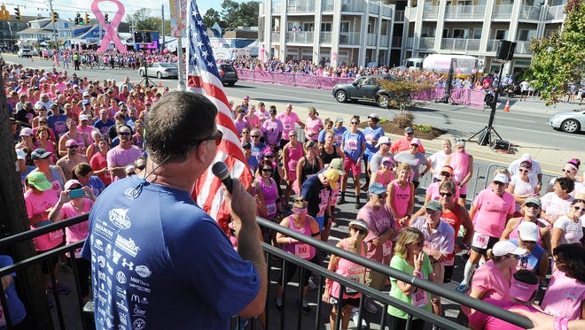 Steve "Monty" Montgomery co-owner of the Starboard in Dewey Beach speaks to the crowd at the Dewey Goes Pink event which is held at his establishment along Coastal Highway and Saulsbury Street.
Special to the News Journal / CHUCK SNYDER