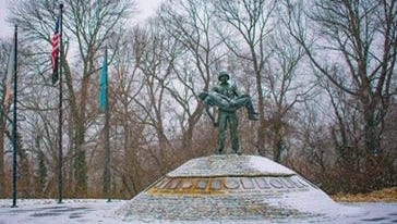Snow begins to stick at the Brandywine Park war memorial.