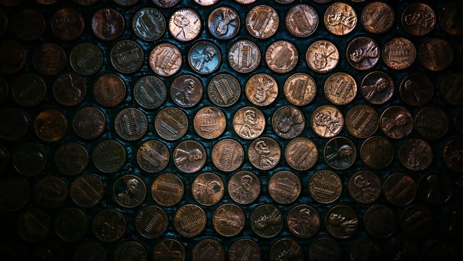 Thousands of pennies adorn the bar at Copperhead Saloon in Greenville.