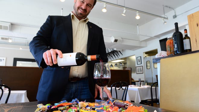Mike Zygmonski, Wine Director at SODEL Concepts, pours the perfect wine for your after Halloween candy pairing on Friday, Nov. 4, 2016 at Lupo Italian Kitchen in Rehoboth, De.