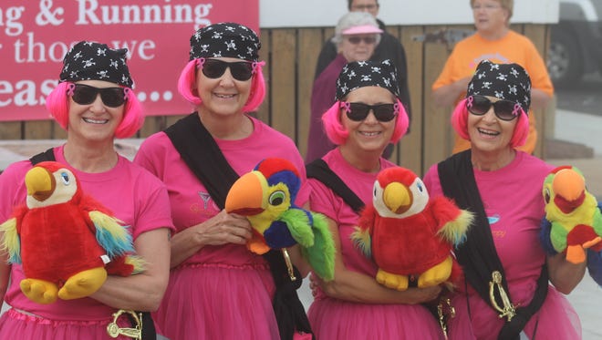 Jeannette Whiteford, Sandy Cook, Sharon Miller and Wanda Edie, known as "The Pink Ladies, dressed in matching pirate costumes in the 2014 Bethany Beach Breast Cancer run.