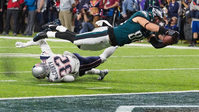 Eagles tight end dives into the end zone to score Sunday night at US Bank Stadium. The Eagles defeated the New England Patriots 41-33 to win Super Bowl LII.