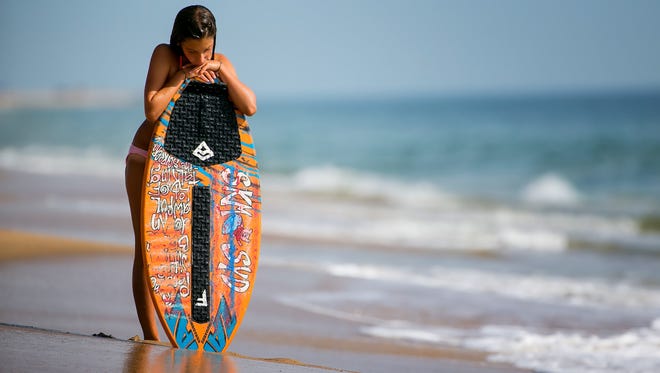 Sydney Pizza,12, practices at Dewey Beach as she prepares to compete at The Zap World Championship of Skimboarding in Dewey Beach this weekend.