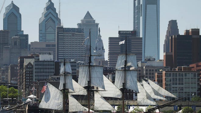 The Oliver Hazard Perry tall ship prepares to dock during the Parade of Sails on the Delaware River in Philadelphia, Thursday, May 24, 2018. The visiting tall ships are part of a three-day Philadelphia and Camden waterfront festival. (David Swanson/The Philadelphia Inquirer via AP)