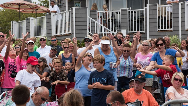 Crowds gather at the marina near 14th street in Ocean City on Monday to watch the White Marlin Open.