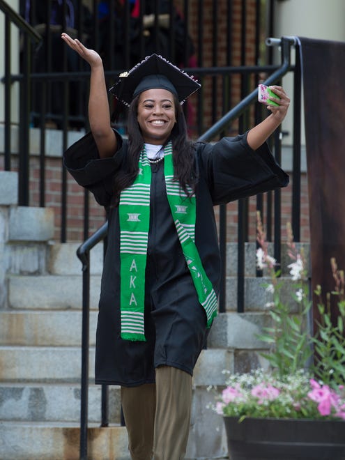 Ann Krystle Loury celebrates before receiving her degree at  the Wesley College Spring Commencement in Dover.  A total of 244 graduated.