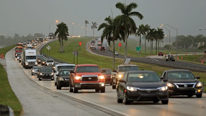 Traffic is seen heading North along the Florida Turnpike near Homestead, Fla., as tourists in the Florida Keys leave town on Sept. 6, 2017.