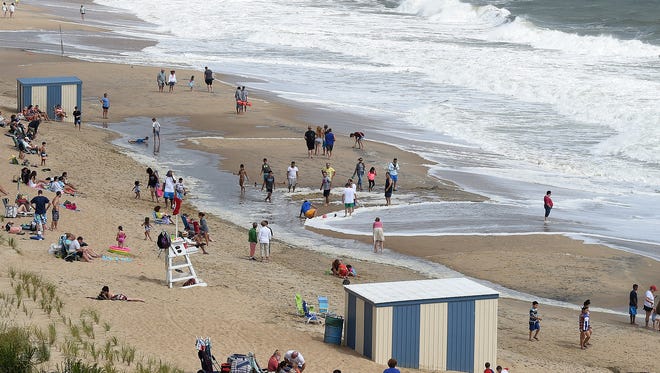 High tide comes up as Tropical Storm Hermine continues to churn about 300 miles off the coast of Delaware producing rough surf and dangerous rip currents. The beach at Rehoboth Beach was open, but the water was closed Sunday, according the beach patrol.