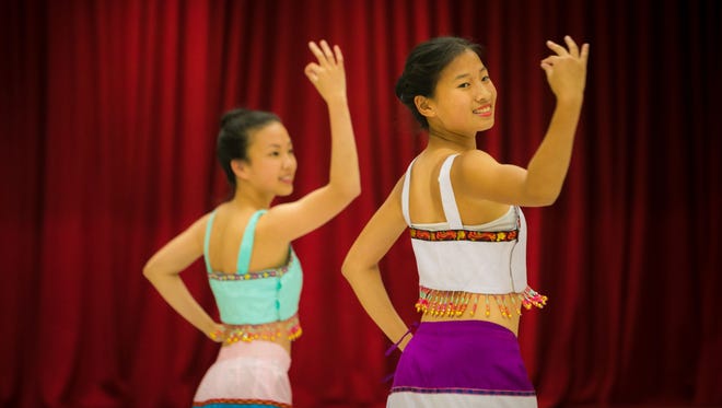 Rachel Wang (right), 16, of Wilmington along with Olivia Reeves and Rhea Jiang (left), demonstrate the Dai Dance that will be performed at the Chinese Festival. The Chinese American Community Center in North Star will be hosting its 25th Delaware Chinese Festival with a three-day celebration starting June 22.