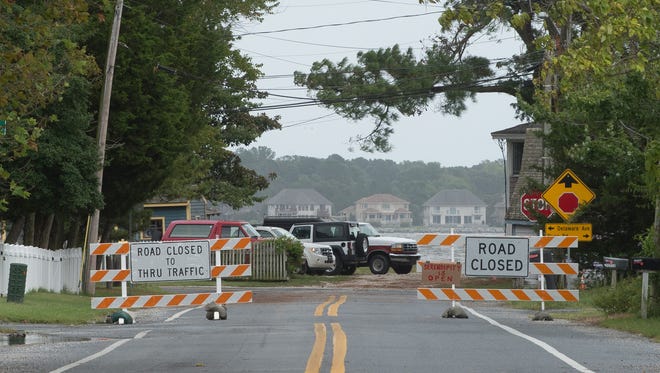 View of road closed sign as you enter Oak Orchard, east of Millsboro, as Tropical Storm Hermine moves off the coast of Delaware.