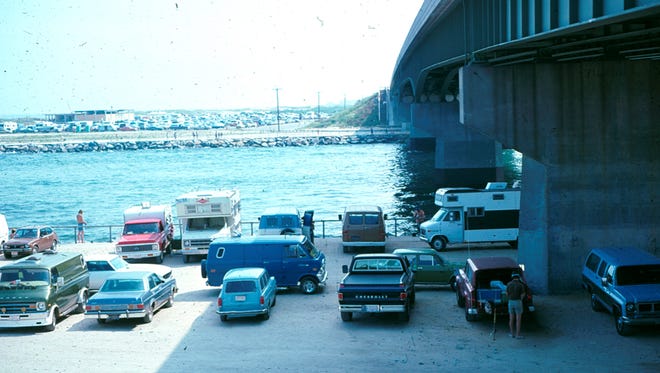 This vintage photo provided by Delaware Seashore State Park depicts a parking lot under the old Indian River Inlet Bridge circa 1977.