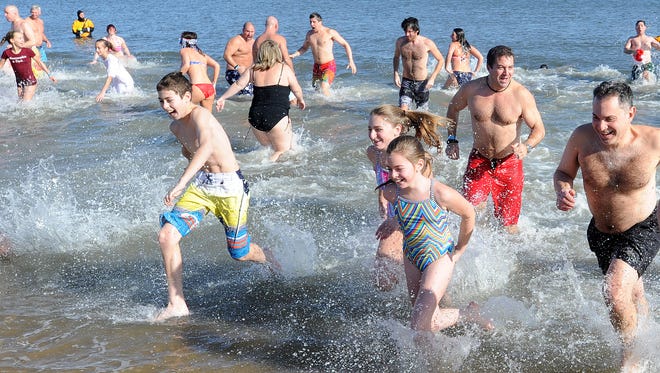 The 3rd Annual Dewey Dunk was held on New Years Day at Dagsworthy Street and the Beach in Dewey Beach, with over 100 people plunging to welcome in 2015.