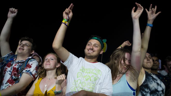 Festival goers enjoy the opening day performance by Chromeo at the Backyard Stage at the Firefly Music Festival in Dover.