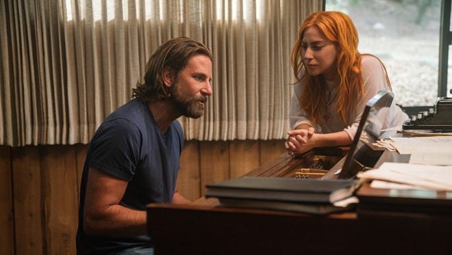 Jackson (Bradley Cooper) and Ally (Lady Gaga) work on their music in "A Star Is Born."